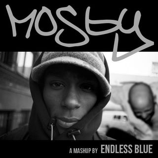 A close-up of Mos Def with Moby perfroming his Play jump in the background.